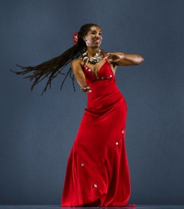 This is an image of Mahea Uchiyama dancing hula in a red dress.