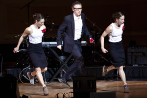 Ira Glass dancing with two dancers