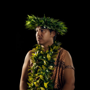 Kawika Alfiche, in a crown and necklace made of leaves