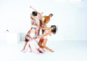 Group of dancers interlocked and touching in a structural pose