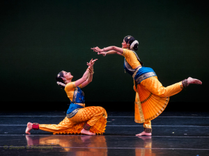 Abhinaya dancers in yellow and blue costumes