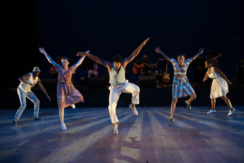 five tap dancers leap on stage