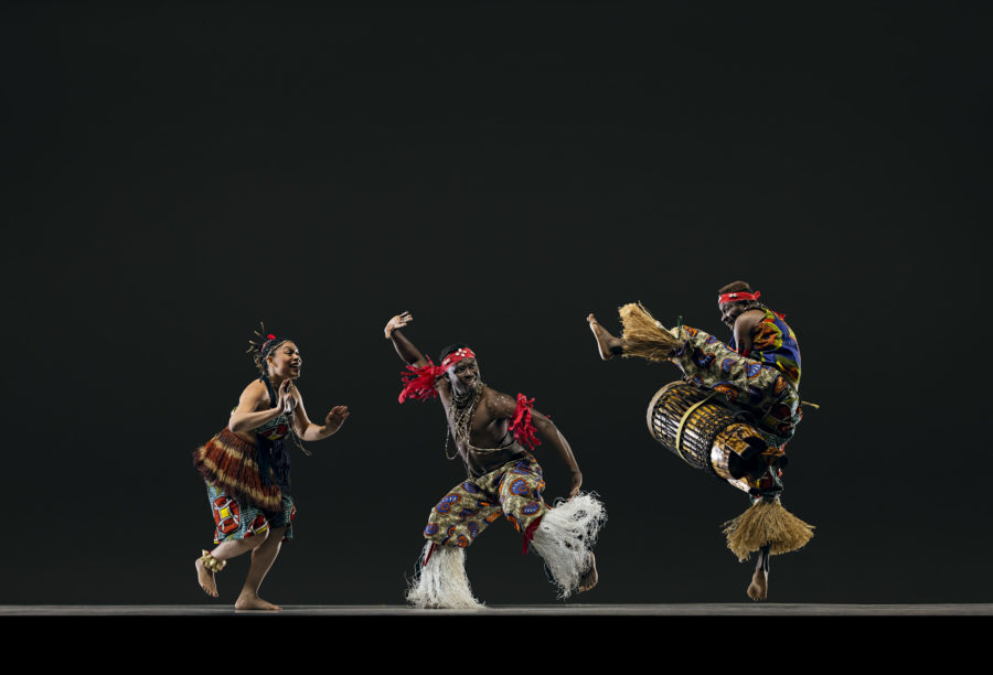 three dancers, one drumming