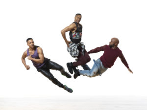 Three dancers jumping