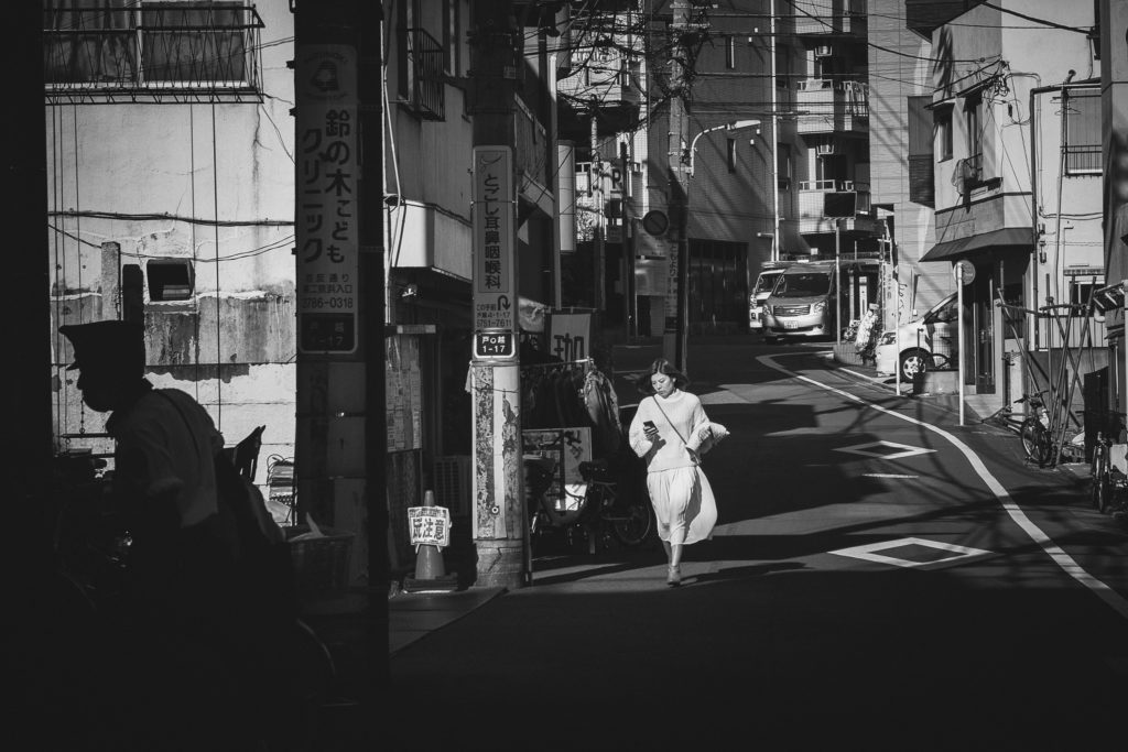 Woman walking on the street in Japan