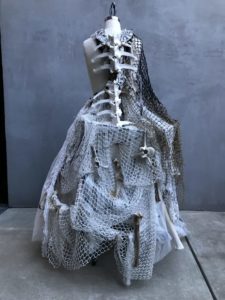 A multi-textured white dress on a mannequin