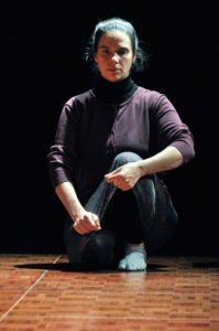 Female dancer seated on the floor