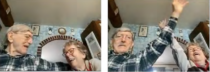 Two older people, Bob and Barb, laughing in their kitchen, arms wrapped around one another.