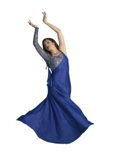 A posed solo shot of Shahrzad Khorsandi in a vibrant blue dress