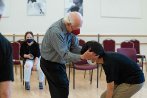 Liv watches intently as an intergenerational duet rehearses at ODC Dance Commons.