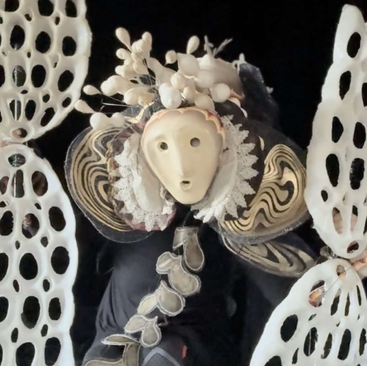 Puppet dressed in multilayered costumes