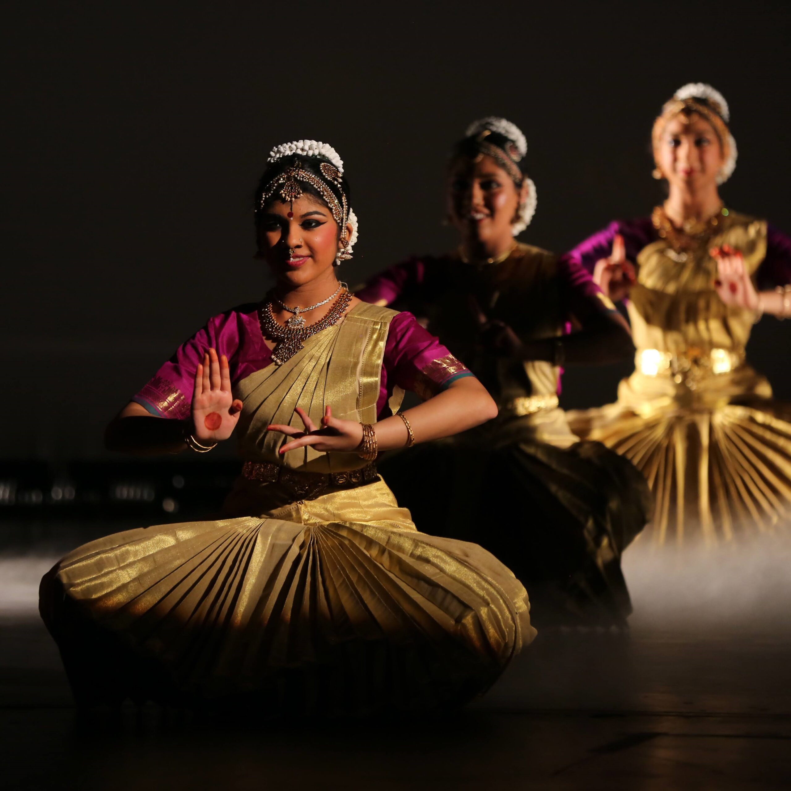 Three of the nine dancers are visible in this picture. Dressed in traditional and elaborate south indian costumes, they depict the nine planets in the universe