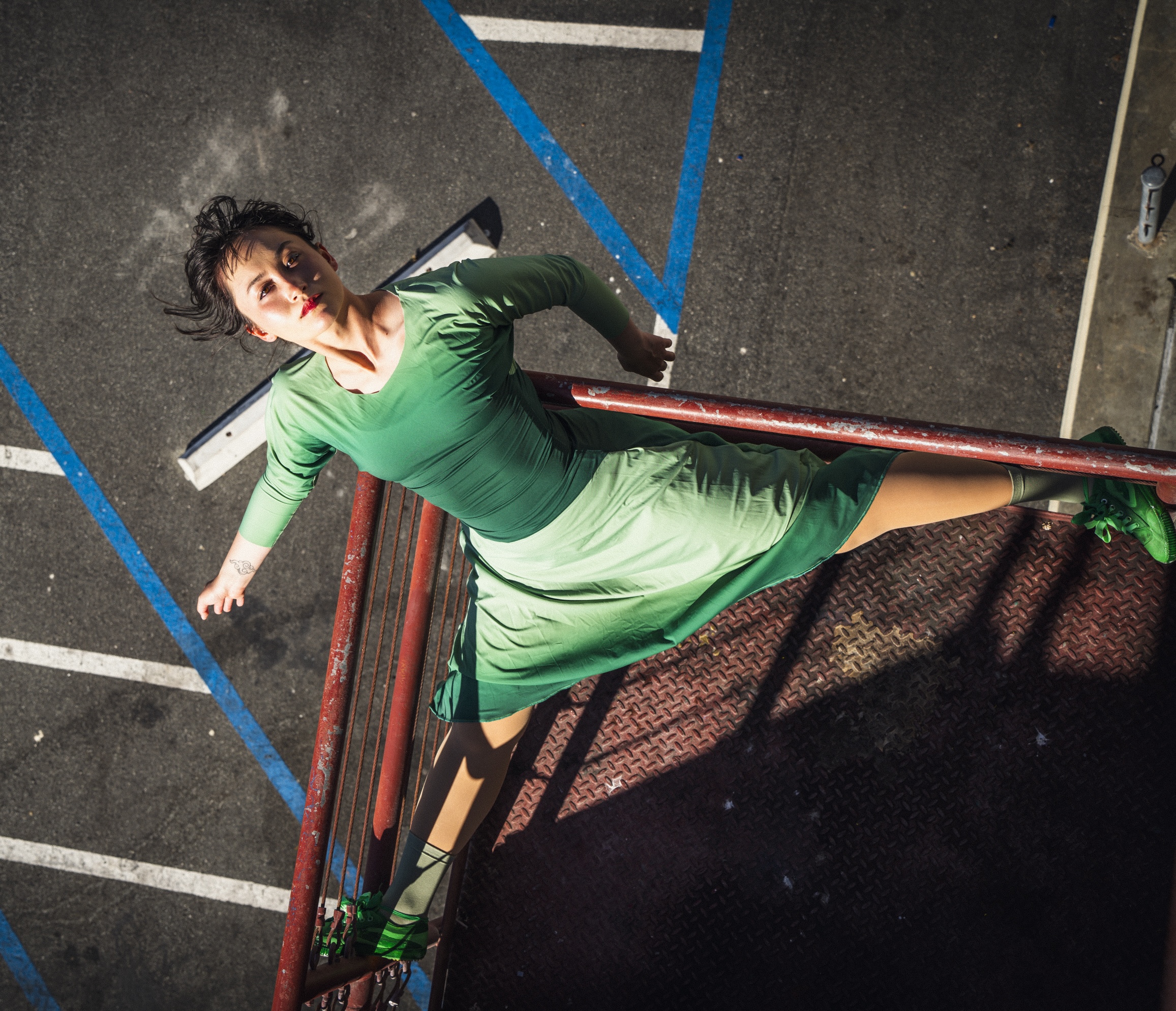 Bi Racial, Female Dancer in Green Dress on Platform above Street