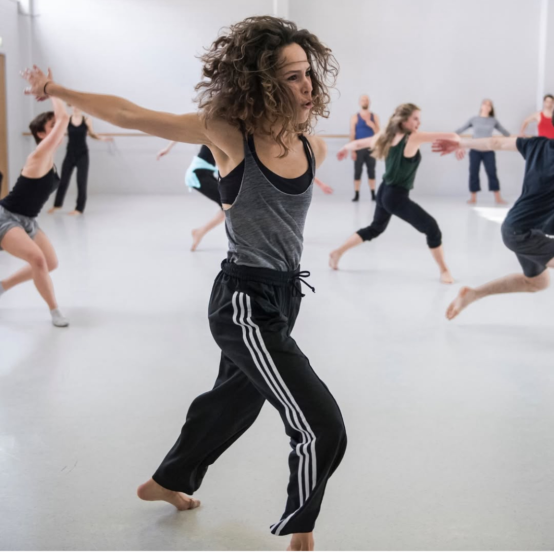 Photo of a dancer lunging forward.