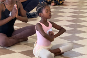 young student of Mbulelo Ndabeni in Ugie, South Africa in a meditation of gratitude at the end of class