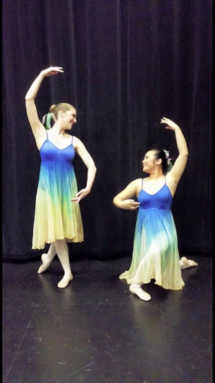 2 adult female dancers holding ballet poses