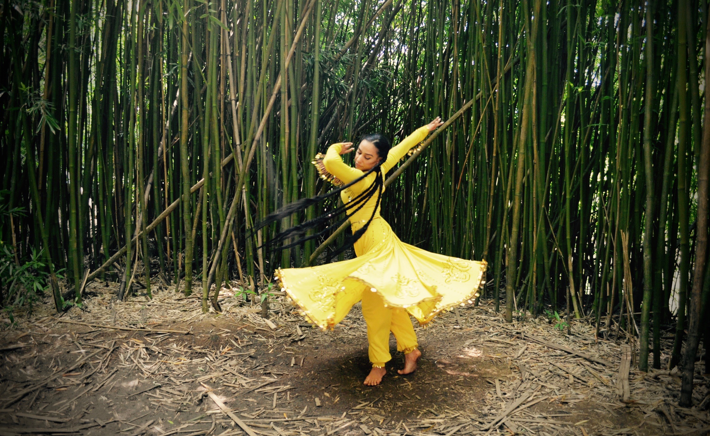 Dancer spinning in yellow 