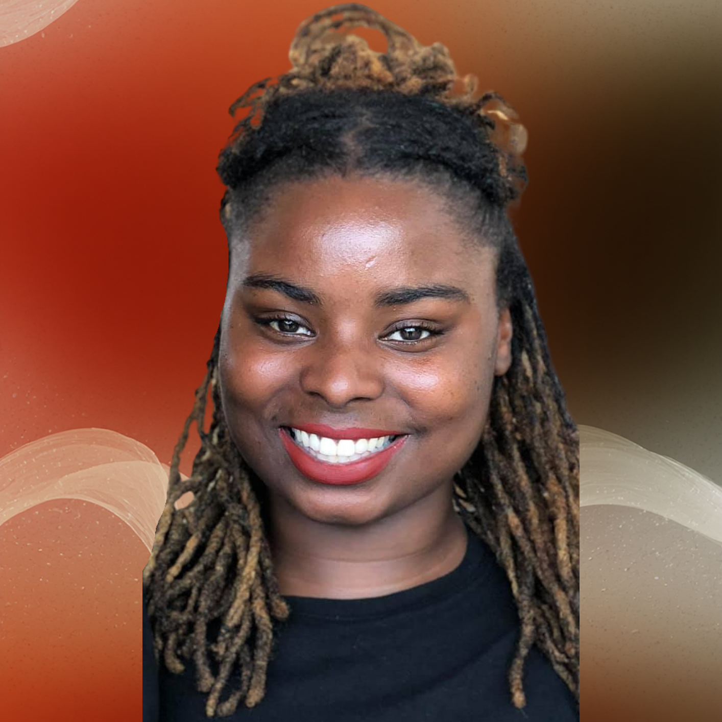 Person is smiling and has locs pulled up in the front with some hanging in the back.