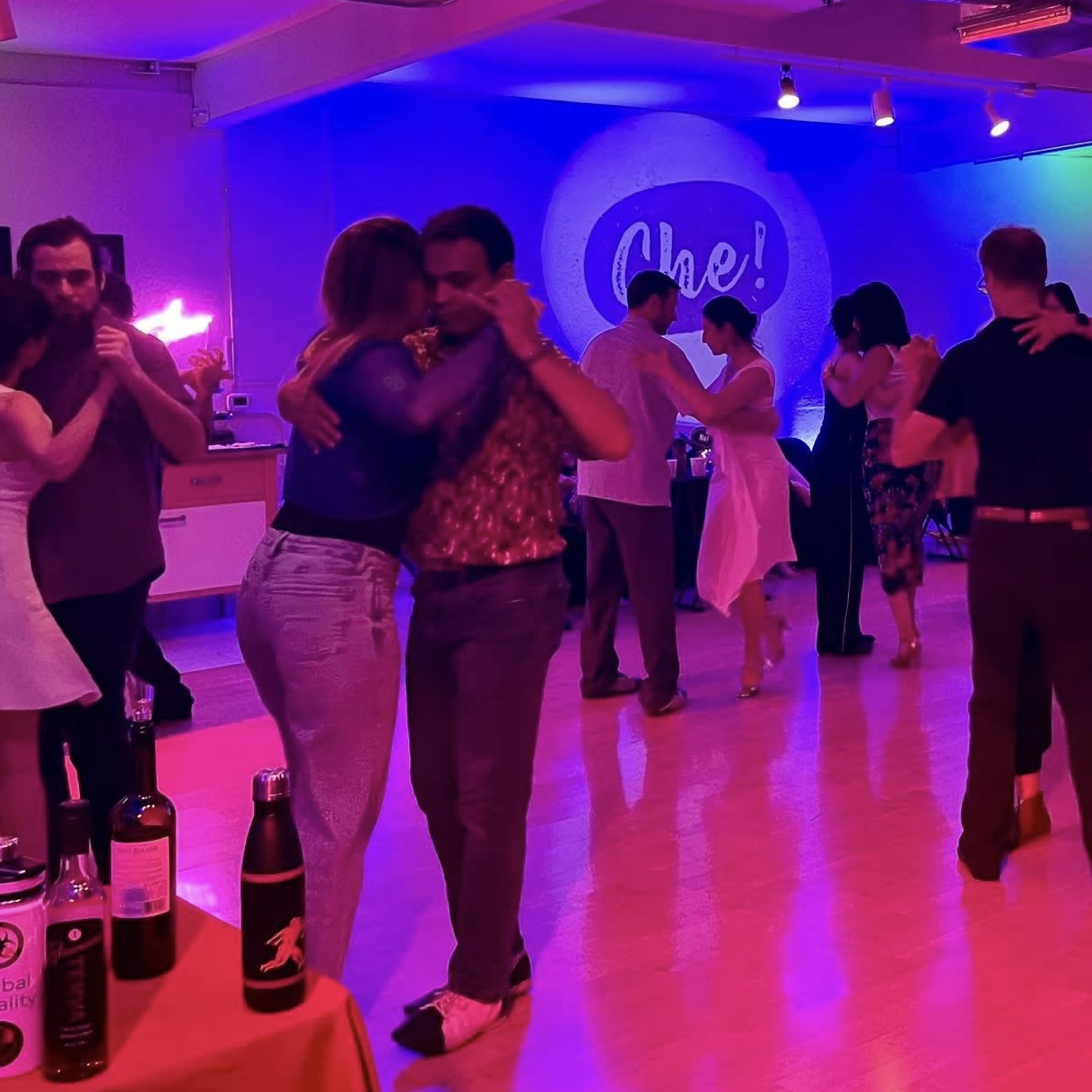 Tango dancers dancing in a milonga (tango dance social)