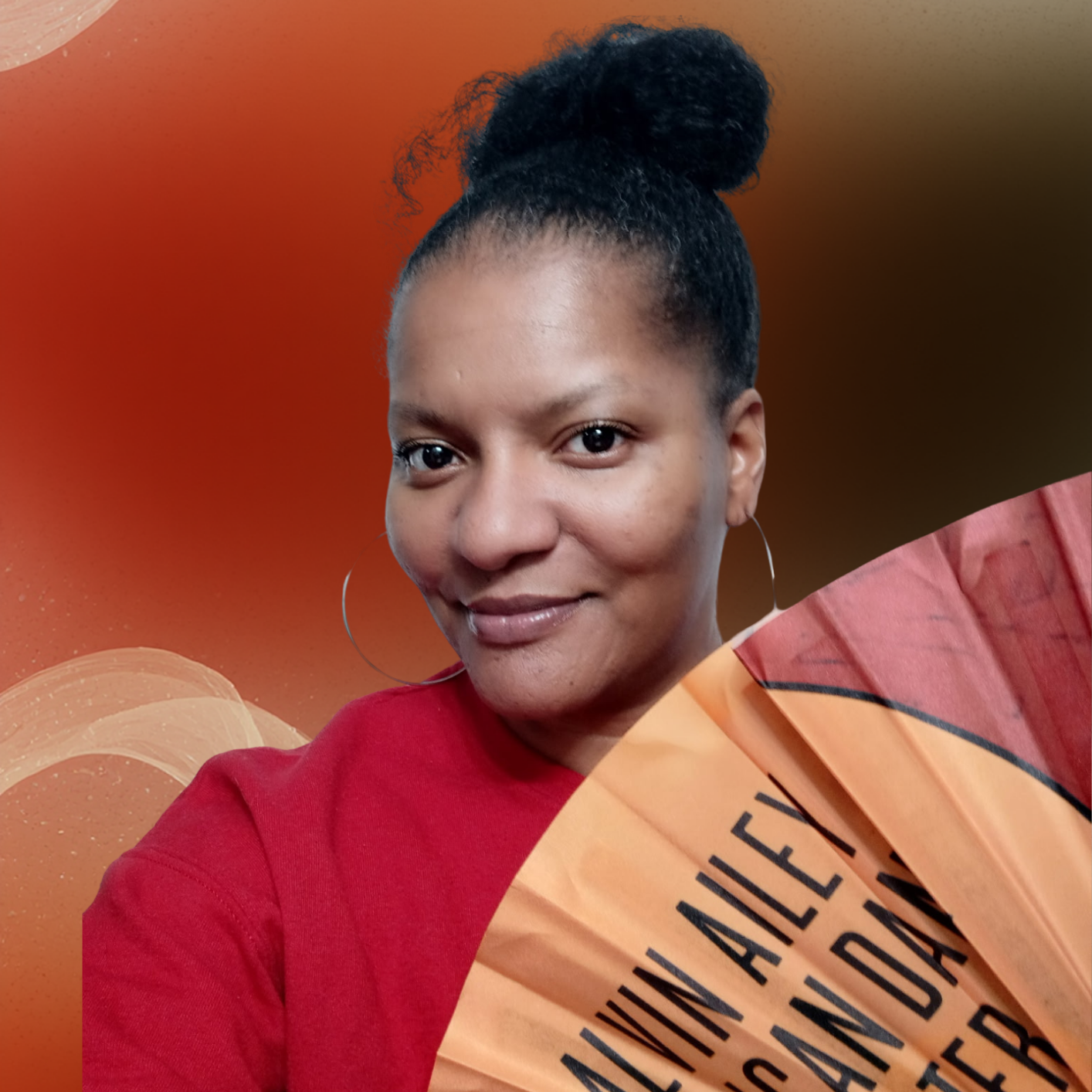 One person, wearing a red top, hair up in a bun and holding a fan.