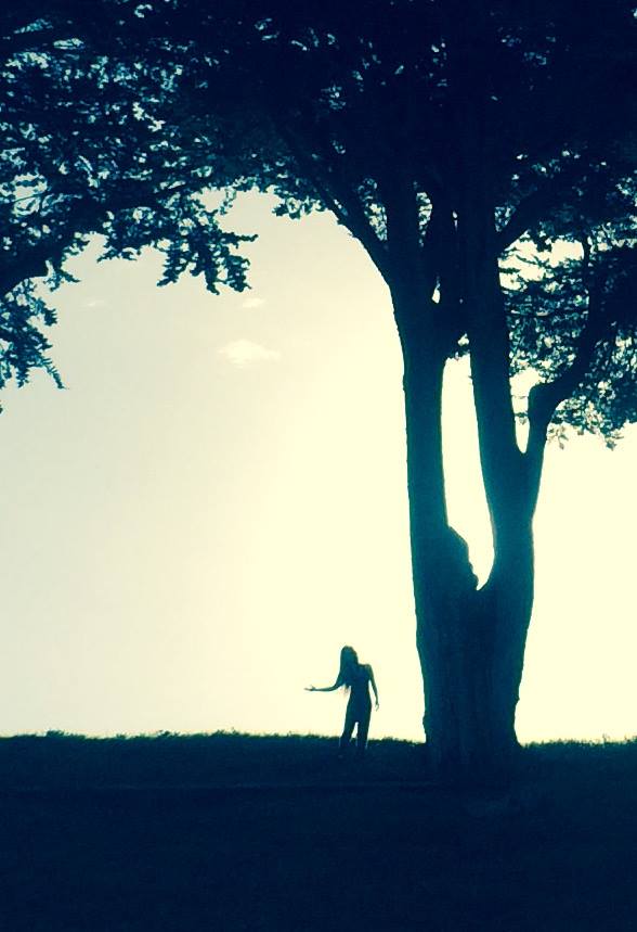 next to a tree